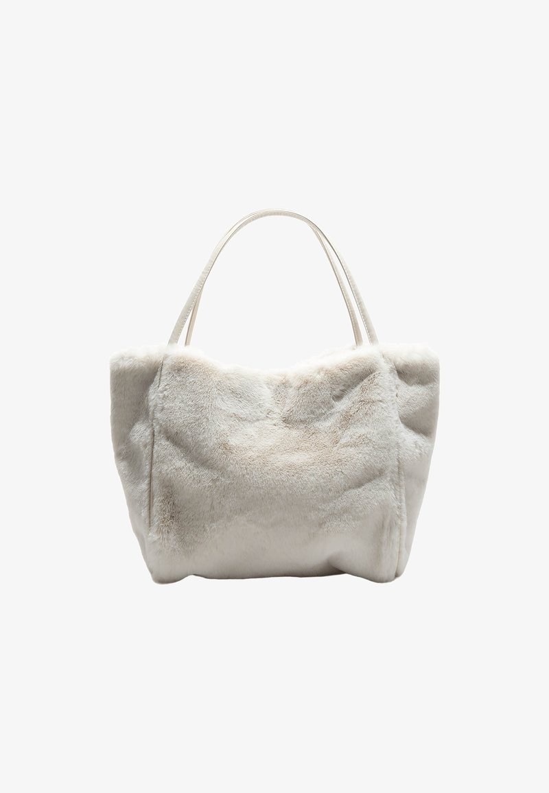 Borsa in pelliccia sintetica di un morbido beige chiaro, con due manici sottili di colore crema, forma rettangolare e una trama sottile.