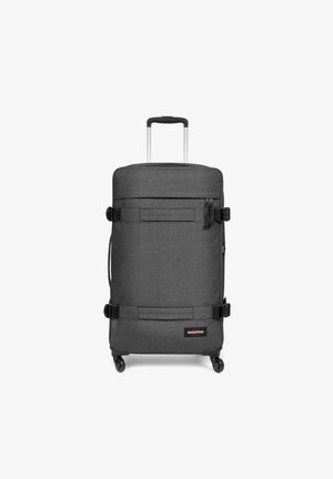Wheeled suitcase in dark gray fabric, rectangular shape, features a retractable handle, two straps, and a zipper pocket on the front.