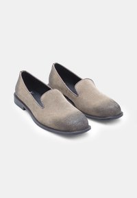 Suede loafers in gradient brown and beige with a rounded toe and a low, flat rubber sole. Slip-on design with no visible hardware.