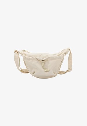 Sac en tissu beige de forme arrondie, fermeture à cordon, et bandoulière ajustable. Texture lisse avec un design minimaliste, sans motifs visibles.