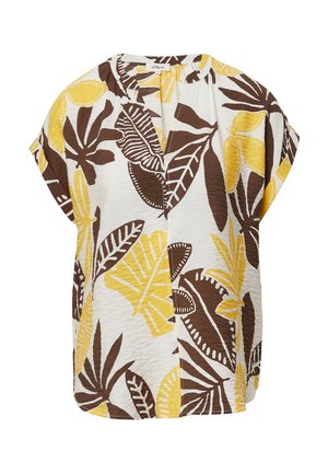 Blouse à manches courtes en blanc avec un motif audacieux de feuilles brunes et jaunes. Texture légère avec une coupe décontractée et un décolleté en V.