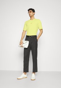 BOSS TCHUP - T-shirt básica - bright yellow