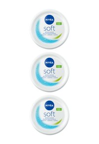 Three circular NIVEA Soft cream jars in white, featuring blue accents, water droplet design, and green "vegan formula" label.