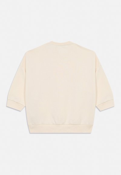 Cremefarvet oversized sweatshirt med sænkede skuldre og ribstrikkede manchetter og kant, vist bagfra på en ensfarvet baggrund.