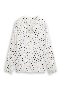 Weiße Bluse mit langen Ärmeln und rundem Ausschnitt, mit einer Schleifenverzierung, durchgehend mit schwarzen Punkten bedruckt. Strukturierter Stoff mit gerafften Manschetten.