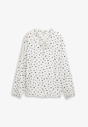 Witte blouse met lange mouwen en een ronde halslijn, voorzien van een strikdetail en versierd met zwarte stippen over het hele oppervlak. Textuurstof met geplooide manchetten.