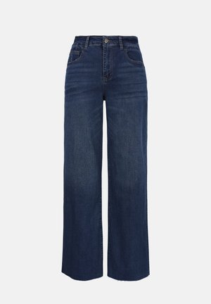 Jean bleu foncé à taille haute, jambes larges, avec poches avant, passants pour ceinture et fermeture par bouton, présenté sur un fond uni.