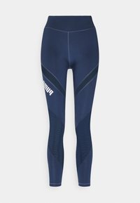 Navy athletic leggings with high waistband, smooth fabric, mesh panels, contrasting seams, and a white logo on the left leg.