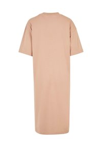 Robe T-shirt beige mi-longue avec manches courtes et col rond, vue de dos sur fond blanc.
