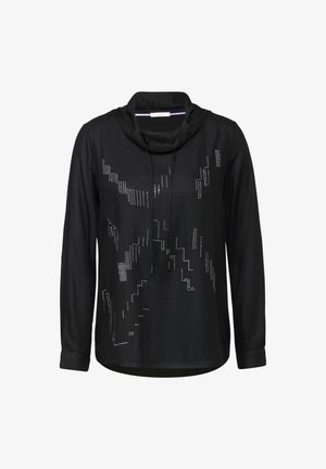 Czarny top z długim rękawem i dekoltem w kształcie liścia, z kontrastowymi akcentami z kryształków w geometrycznym wzorze na przodzie. Miękki materiał.