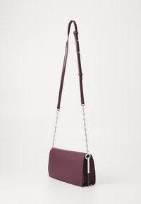 Calvin Klein CONVERTIBLE MINI BAG - Cross body bag - vineyard wine