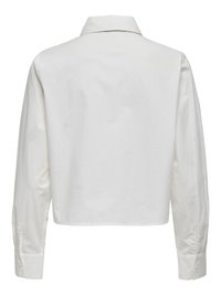 Chemise blanche à manches longues avec col, vue de dos, avec poignets boutonnés et ourlet droit.