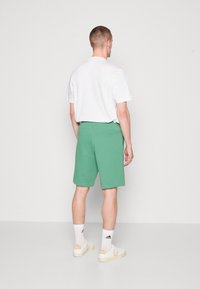 adidas Originals Spodnji deli trenirk - preloved green