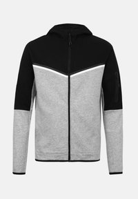 Φούτερ με φερμουάρ πλήρους μήκους, με μαύρο πάνω μέρος, γκρι κάτω μέρος και μανίκια, λευκή ρίγα και τσεπάκι με φερμουάρ στο αριστερό πάνω μανίκι.