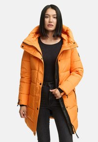 Bright orange puffer jacket with a hood, featuring a zip closure, snap buttons, and logo detailing along the front. Soft, quilted texture.