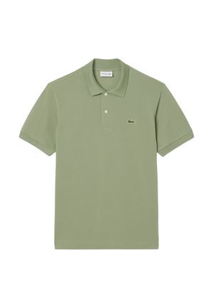 Short-sleeve polo shirt in light green cotton with a three-button collar and a small embroidered crocodile logo on the left chest.