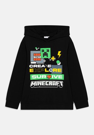 Sort sort sweatshirt med hætte, der har farverige Minecraft-tema grafik, inklusive ordene "Skab," "Udforsk," "Overlev," og forskellige spilleikoner.