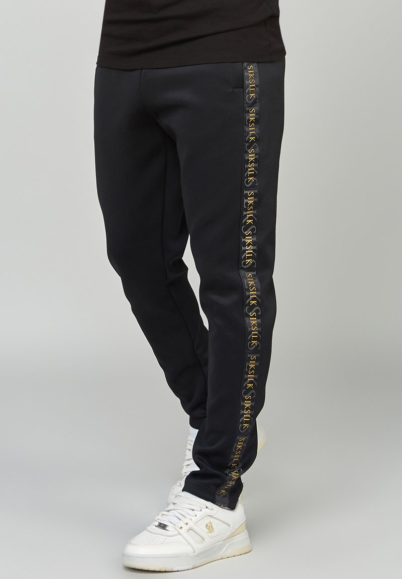 SIKSILK Tracksuit bottoms - black