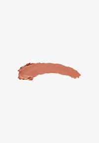 Creamy matte lipstick swatch in a warm, soft peach color, with a smooth texture and slightly glossy finish.