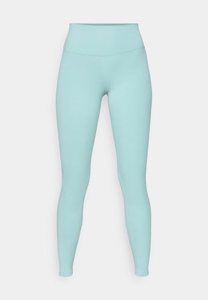 Lys teal leggings laget av elastisk materiale. Høy midje-design med sømløs tekstur og tettsittende silhuett. Ingen synlige mønstre eller accenter.