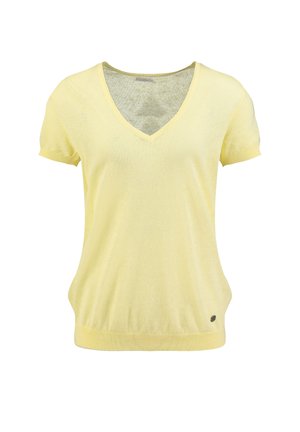 Top lavorato a maglia giallo chiaro con maniche corte a V, polsini e orlo a costine, con un piccolo logo metallico rotondo vicino all'orlo inferiore.