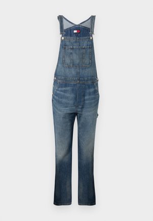 Salopette in denim, lavaggio blu, spalline regolabili, due tasche frontali e una tasca sul petto, leggera scoloritura alle gambe, vestibilità dritta.