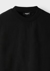 Black crew neck sweatshirt with ribbed collar and a small brand label "BUROCS BUILT TO LAST M" sewn inside the neckline.