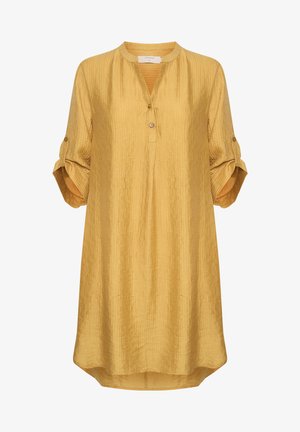 Mustár sárga tunika blúz ráncos anyagból, kerek nyakkal, három gombbal és felgöngyölt ujjak gomb részletekkel.