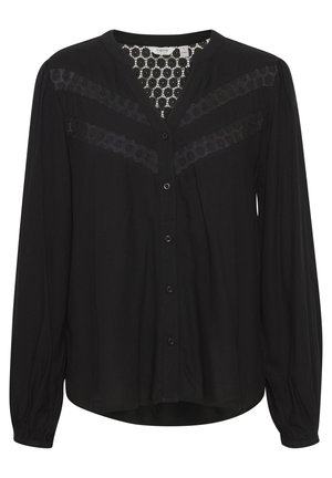 Mustrem pikkade varrukatega pluus V-kaelusega, millel on pitsist detailid õlgadel ja nööpidega esitamise, valmistatud kergest kangast.