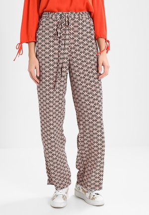 Pantalons à jambes larges dans un motif géométrique rose et noir, dotés d'une taille élastique avec un cordon de serrage. Fabriqués en tissu léger.