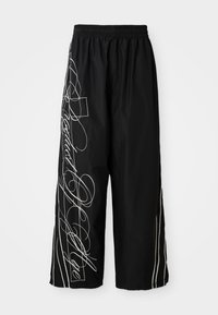 Black, wide-leg, cropped pants made of lightweight fabric. Features white embroidered designs and accents flowing down the sides. Elastic waistband.