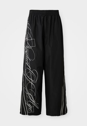 Black, wide-leg, cropped pants made of lightweight fabric. Features white embroidered designs and accents flowing down the sides. Elastic waistband.
