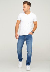 Unselected, dark blue denim