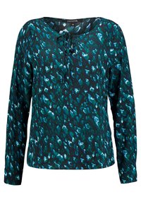 Długi rękaw bluzki w ciemnym odcieniu teal z niebieskim i białym abstrakcyjnym wzorem; posiada okrągły dekolt z detalem w postaci wiązania i miękką fakturę.