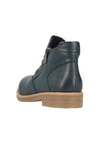 Stivale alla caviglia in pelle verde scuro con cerniera laterale, punta tondeggiante, suola testurizzata e dettaglio del logo sul retro. Suola in gomma per una buona aderenza.