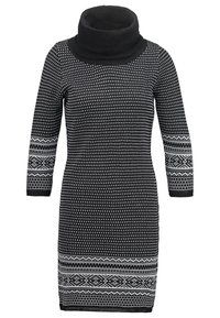 Robe noire avec un col montant plié, des manches trois-quarts et des motifs géométriques blancs le long des manches et de l'ourlet. Tissu en maille doux.