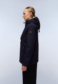 Navy blue waterproof jacket with a hood, front pockets, and a zipped side pocket. Features a badge on the left arm and drawstrings at the hem.
