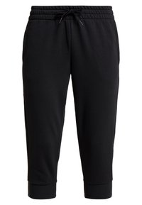 Svarta sweatpants gjorda av tyg med elastisk midja och dragsko. Har en tapered passform med muddar vid benen. Enkel, minimalistisk design.