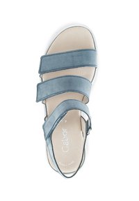 Blue suede sandal with three adjustable straps, an open toe, and a cushioned insole. Features a slight wedge sole for support.