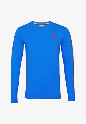 Camiseta de manga larga en algodón azul brillante con cuello redondo. Presenta un logo rojo en el pecho y texto rojo a lo largo de una manga.