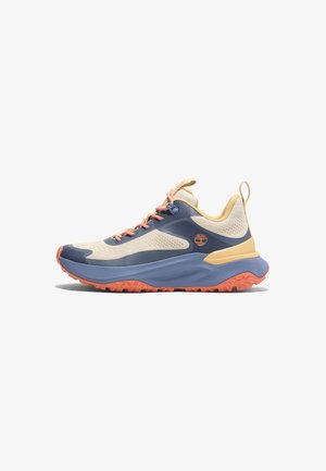 Trail running shoe with a cream upper, navy blue accents, and orange soles. Features mesh fabric, cushioned collar, and textured outsole.