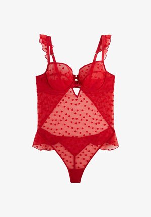 Body in lingerie rossa trasparente con motivi a cuore, spalline arricciate, coppe con ferretto e slip a perizoma.