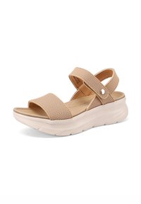 Sandal beige con cinturini in rete, chiusure regolabili in velcro e una soletta ammortizzata. Suola bianca leggera e chunky con superficie testurizzata.