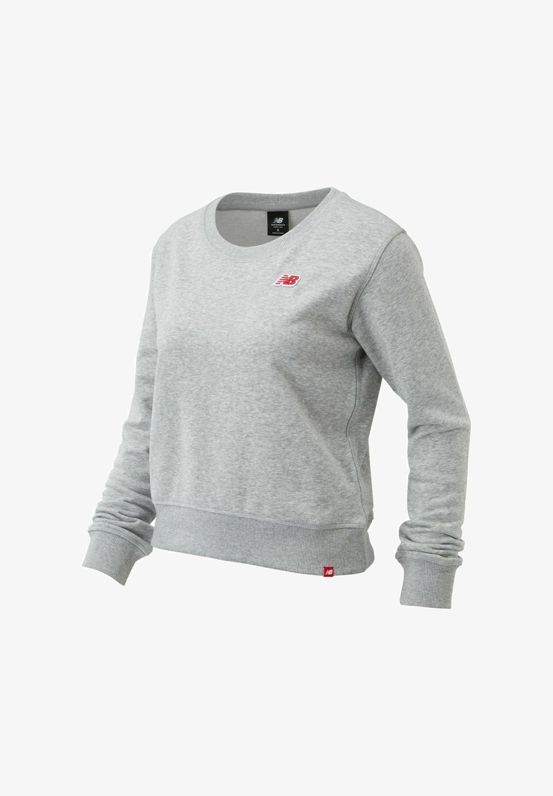 Gray sweatshirt made of cotton blend, featuring a round neckline, ribbed cuffs and hem, and a small red logo on the left chest.