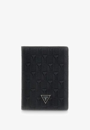 Black textured Guess wallet with chevron pattern and triangular metal logo on front, standing upright on white background.