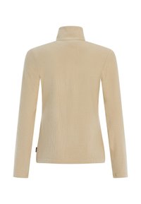 Beige langärmelige top met een hoge kraag, met een geribde textuur en een relaxte pasvorm, zonder zichtbare hardware of accenten.