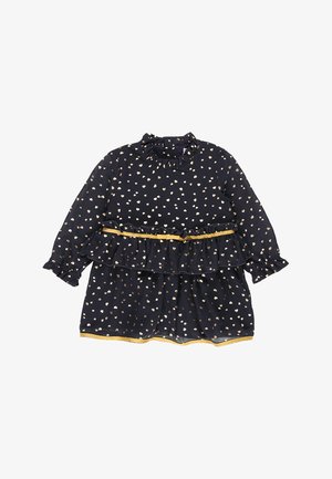 Navy dress with long sleeves, gold heart pattern, layered ruffle design, and a gold trim at the waist and hem. Soft, flowing fabric.