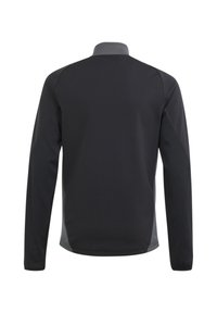 Schwarze Jacke mit langen Ärmeln und hohem Kragen, die graue Akzente und eine glatte Textur aufweist. Entwickelt für eine schlanke Passform mit dezenten Details.