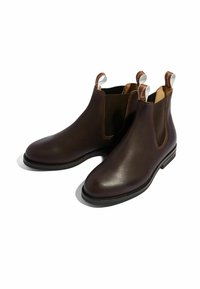 Botas Chelsea de cuero marrón con paneles laterales elásticos y tiradores, con un acabado suave, puntera redondeada y tacón bajo apilado.