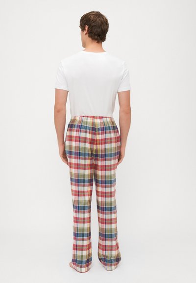 Pantalons de pyjama à carreaux avec une taille élastique. Présentent des motifs multicolores en rouge, bleu, jaune et vert sur fond blanc.